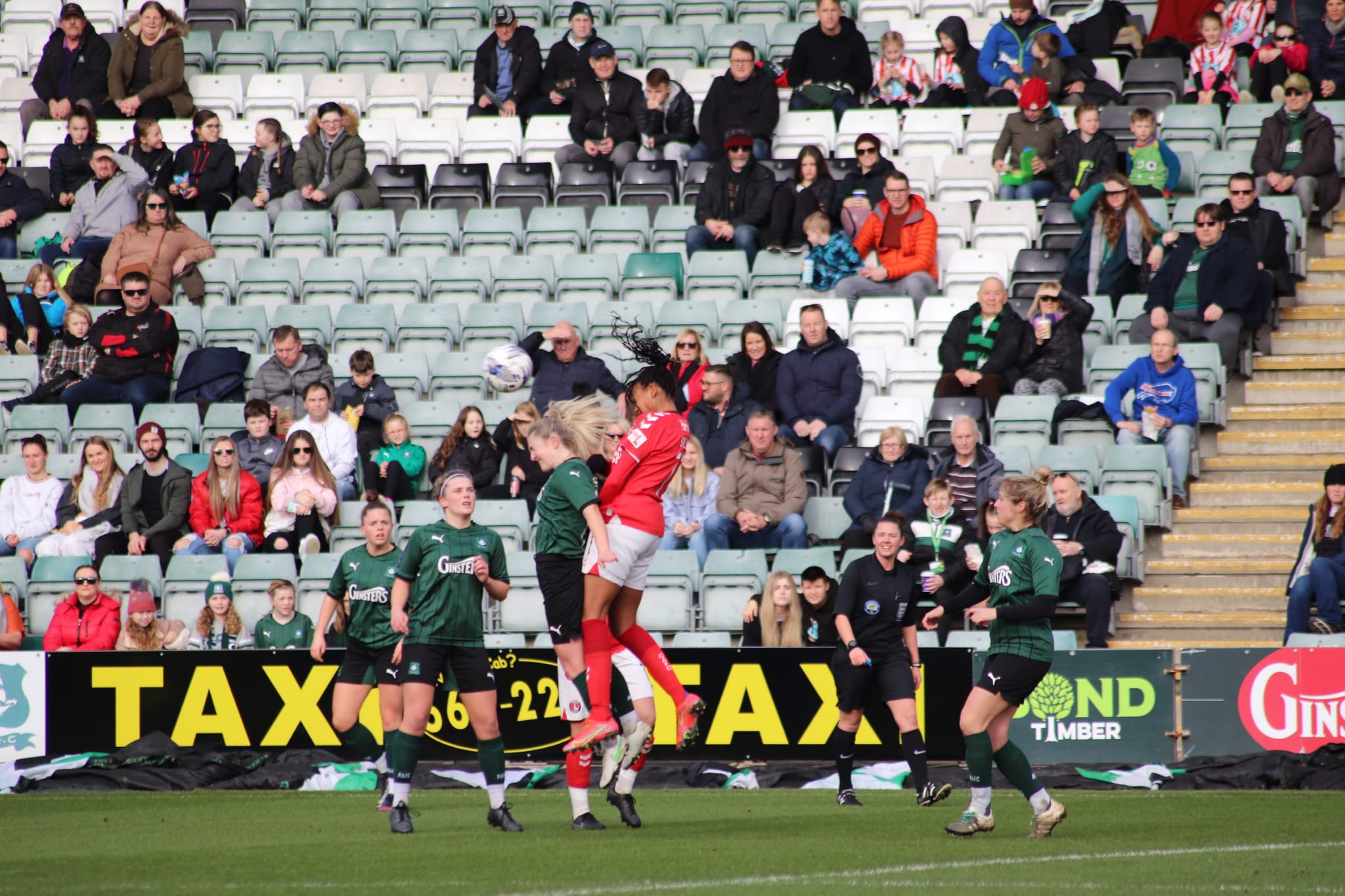Zoe Cunningham challenges for a header at Home Park