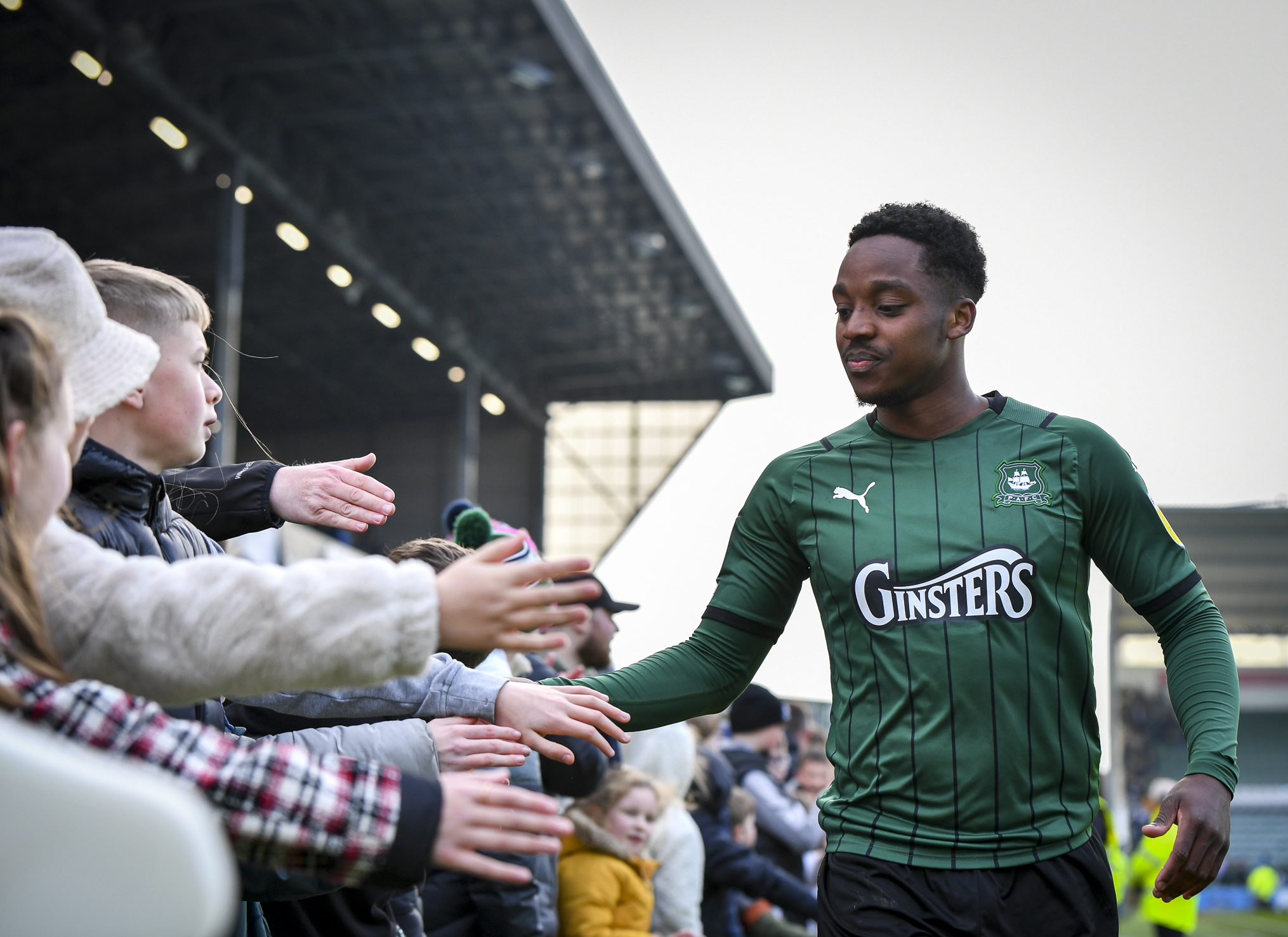 Niall Ennis celebrates with young fans