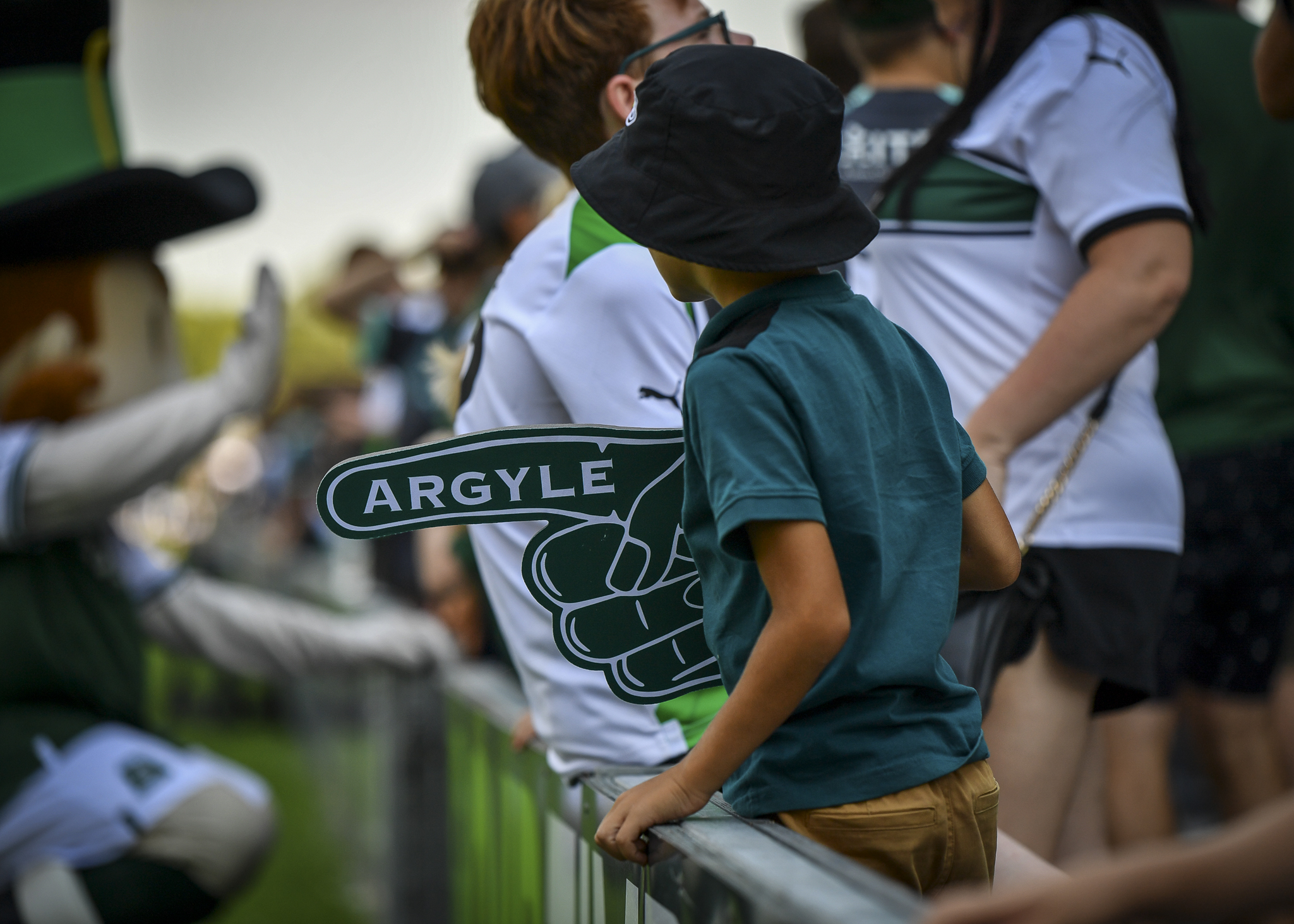 Young supporter with a foam finger at Home Park
