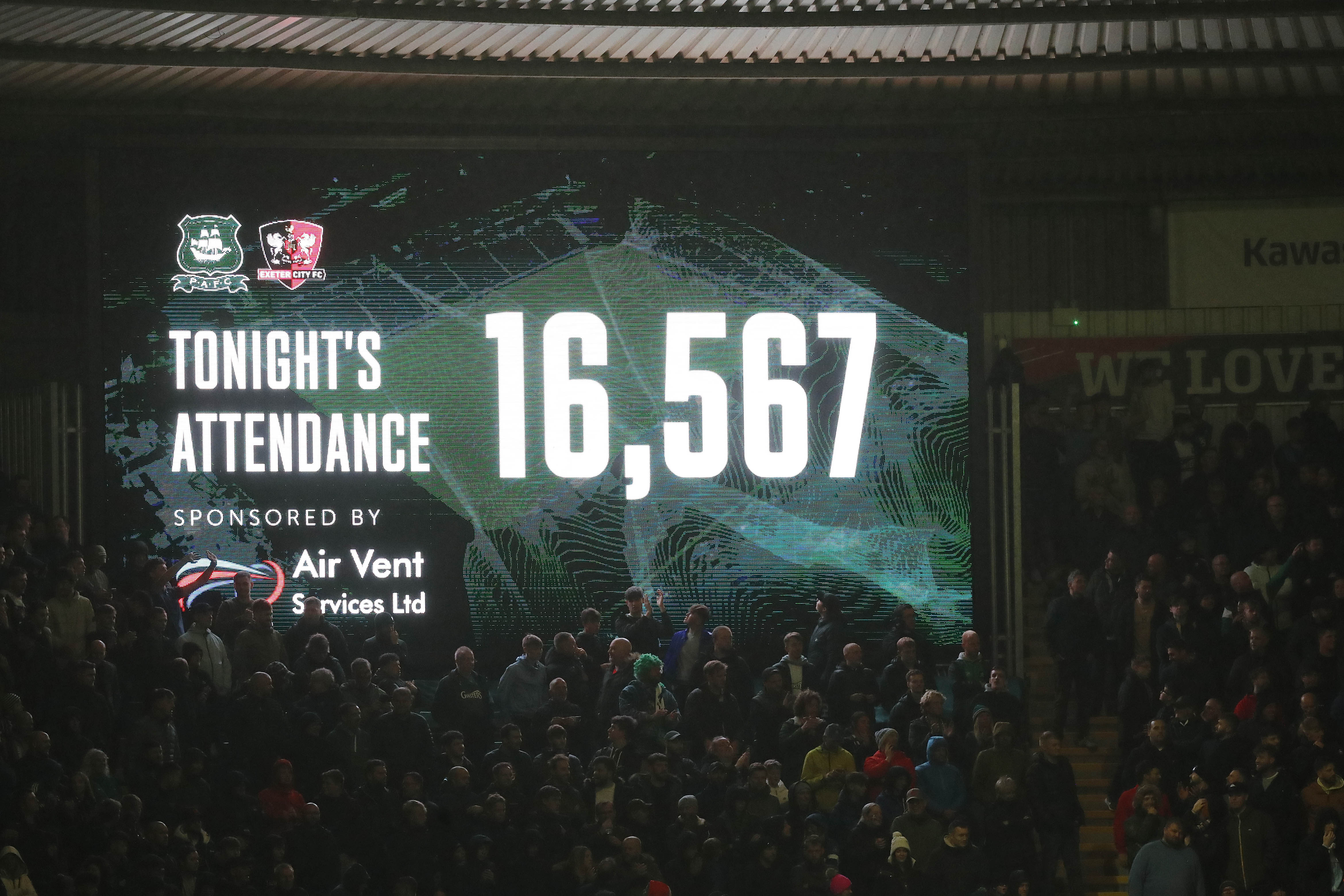 Big screen showing attendance at Devon derby