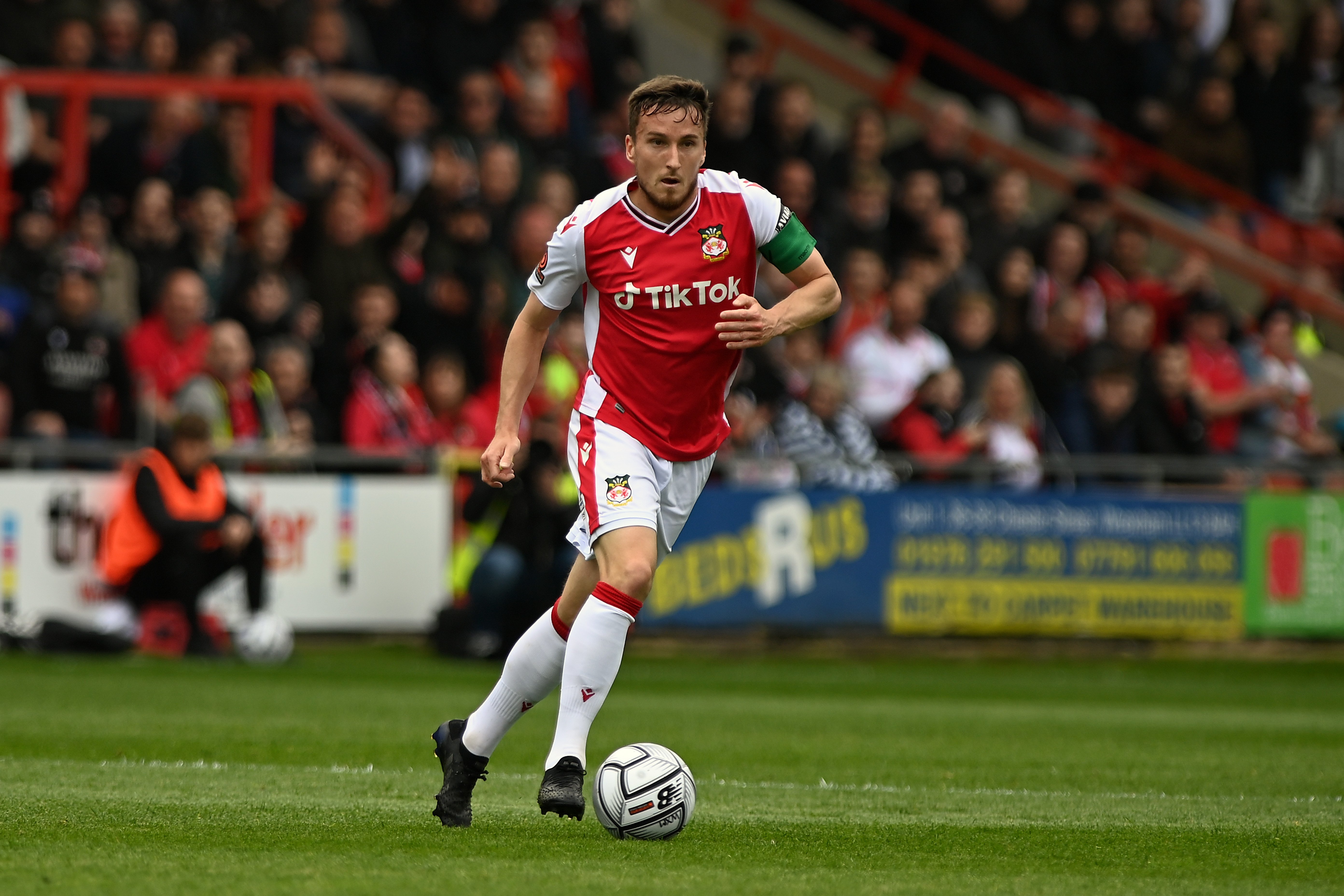 Luke Young playing for Wrexham