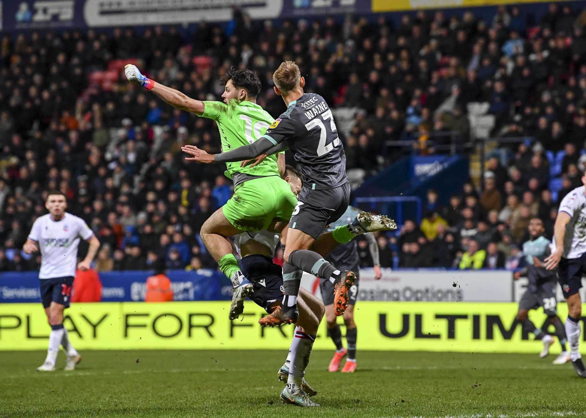 Ben Waine challenges for the ball