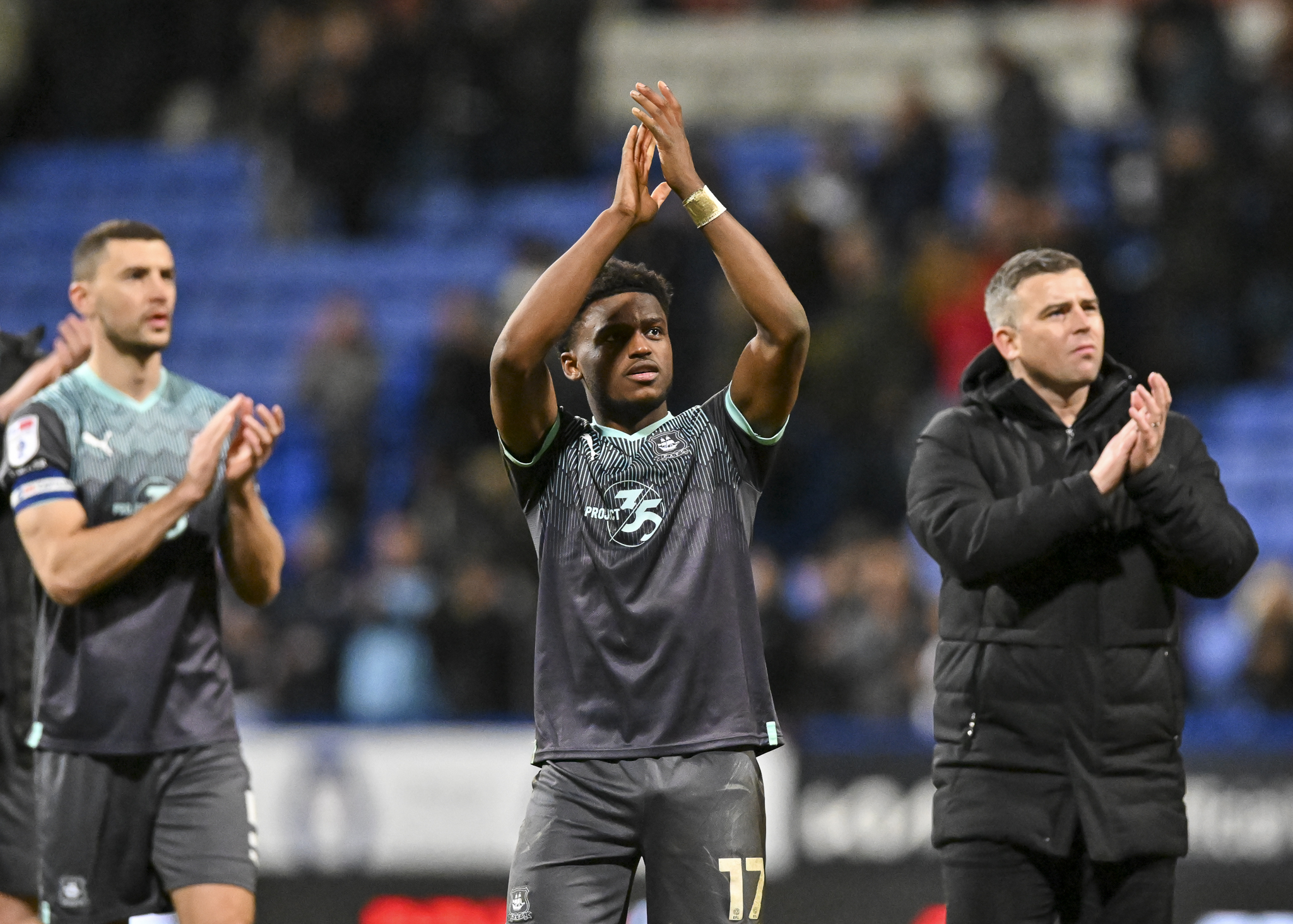 James Wilson, Bali Mumba ans Steven Schumacher clapping fans at Bristol Rovers