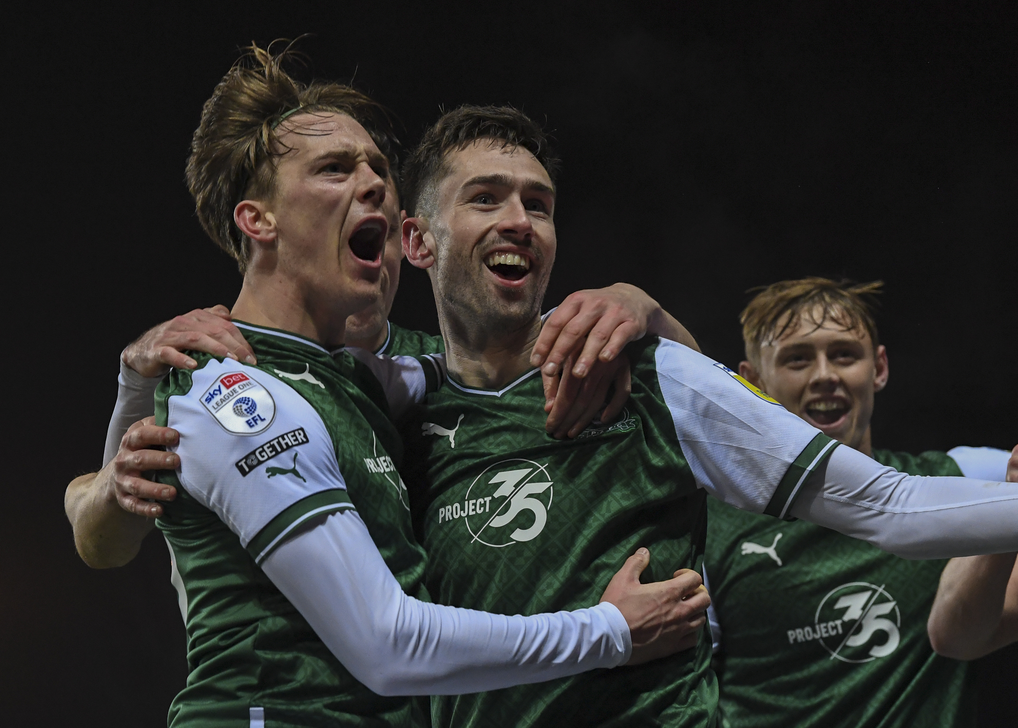 Callum Wright and Ryan Hardie celebrate following Argyle's third goal at Oxford