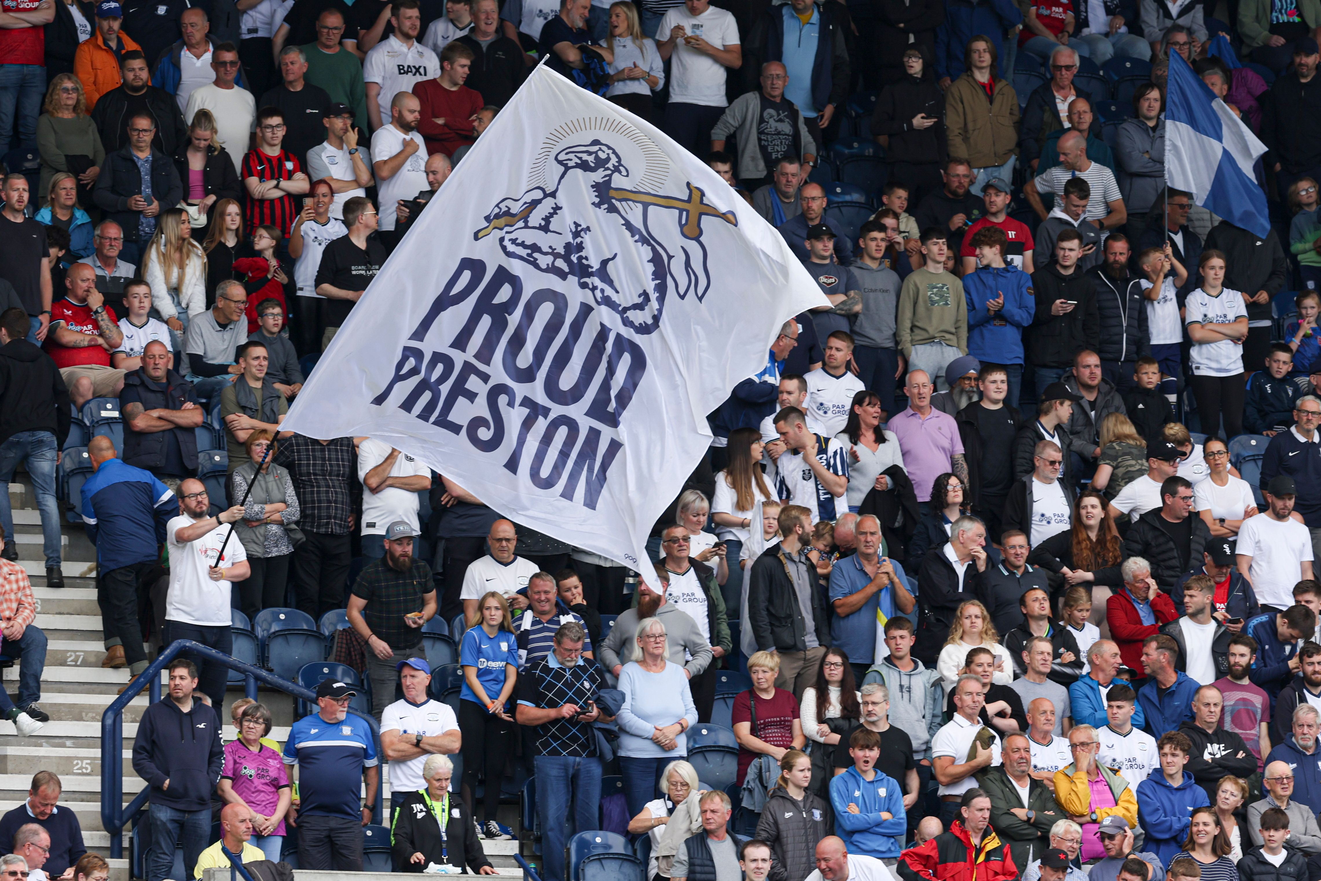 Preston North End fans with a Proud Preston flag