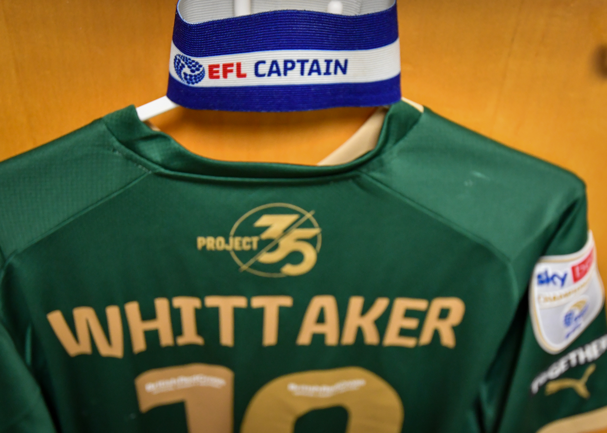 Whittaker's shirt hanging in the dressing room with the Captain's armband
