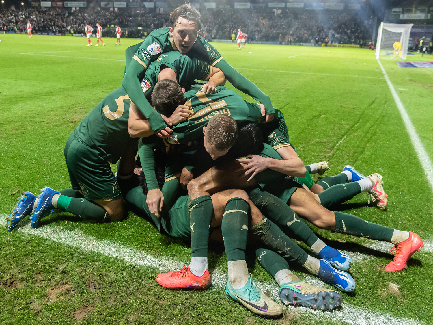 Argyle players celebrate after a late winner against Rotherham