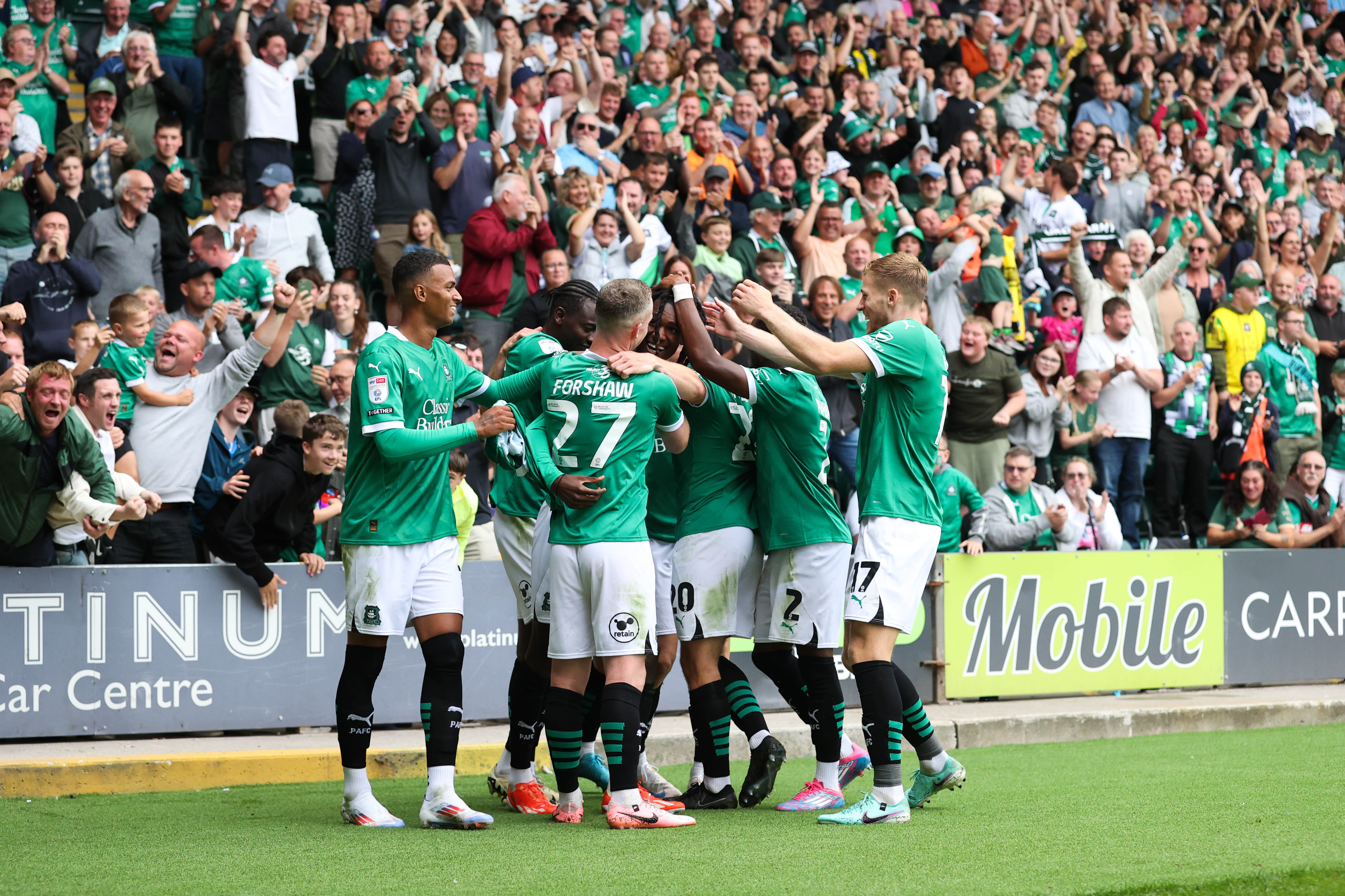 Argyle players celebrate a goal