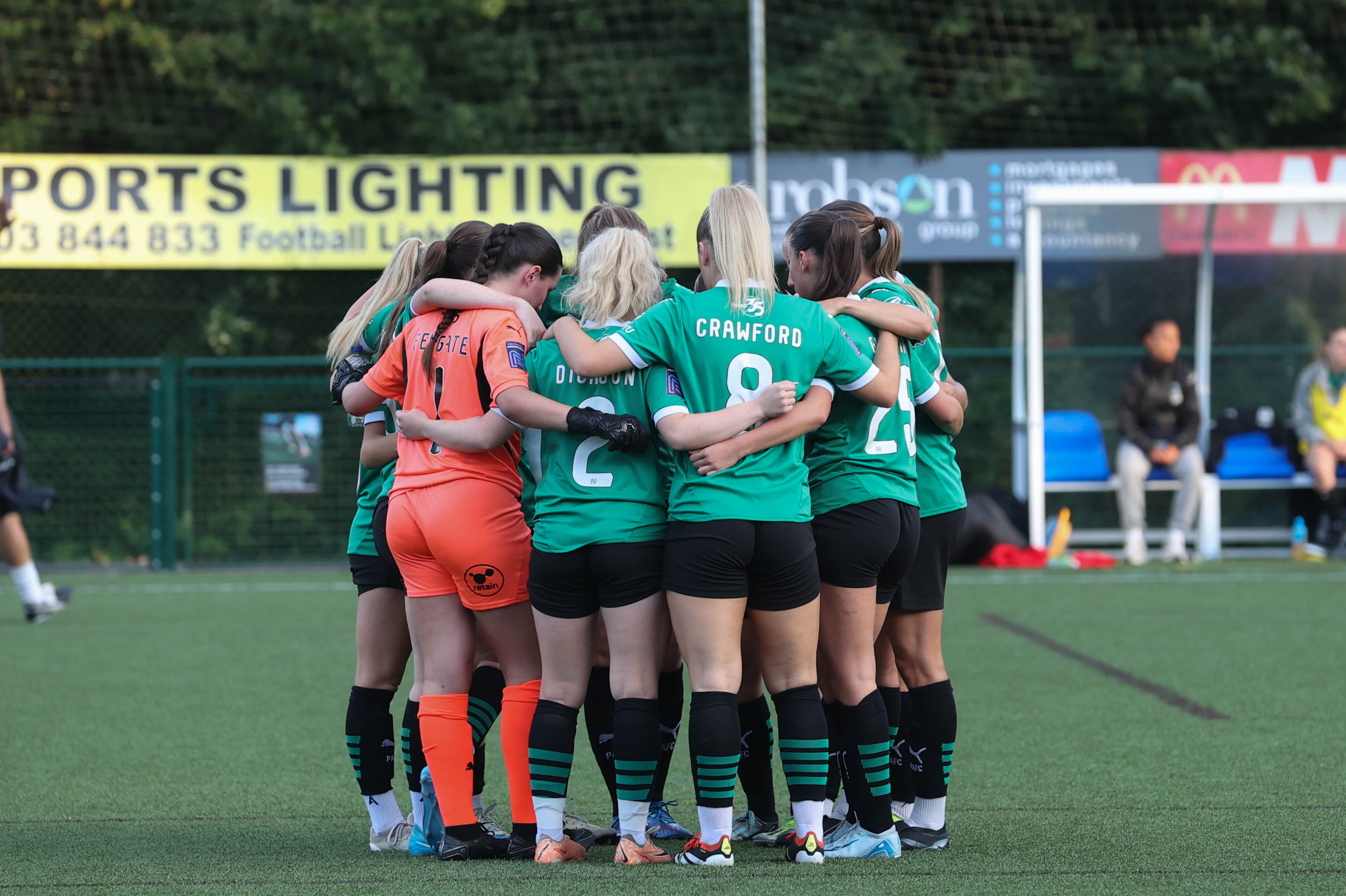 Argyle women huddle