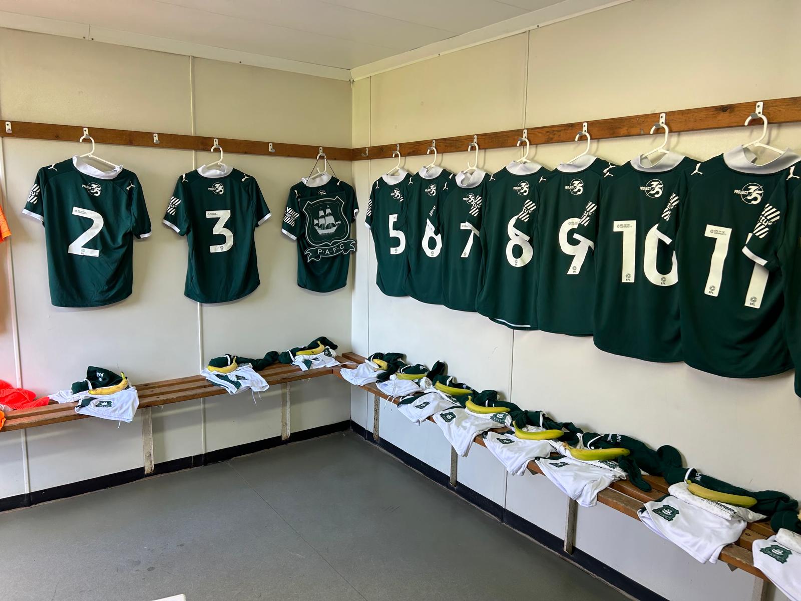 Argyle shirts hung up in a dressing room