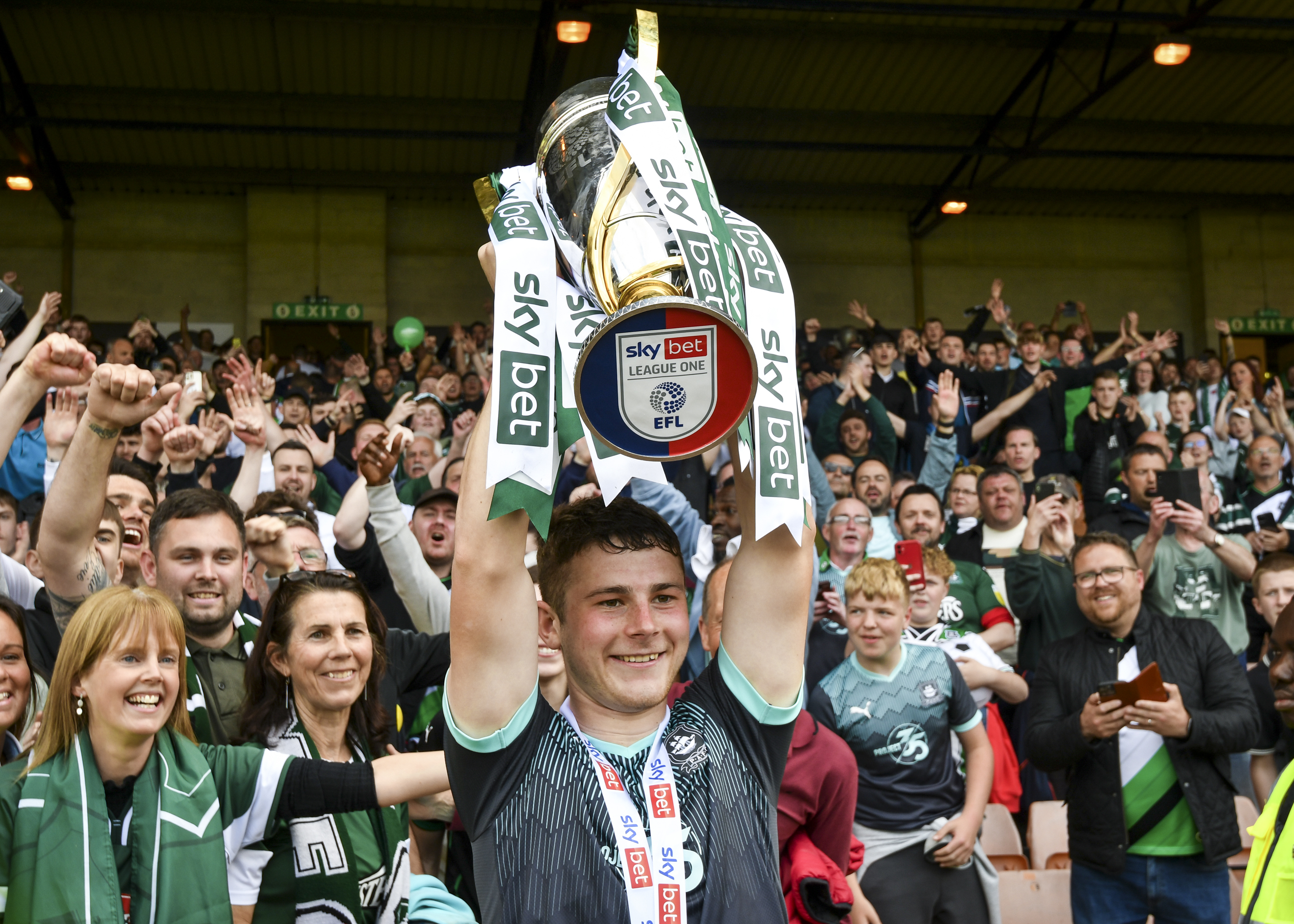 Adam Randell lifts the sky bet league one trophy