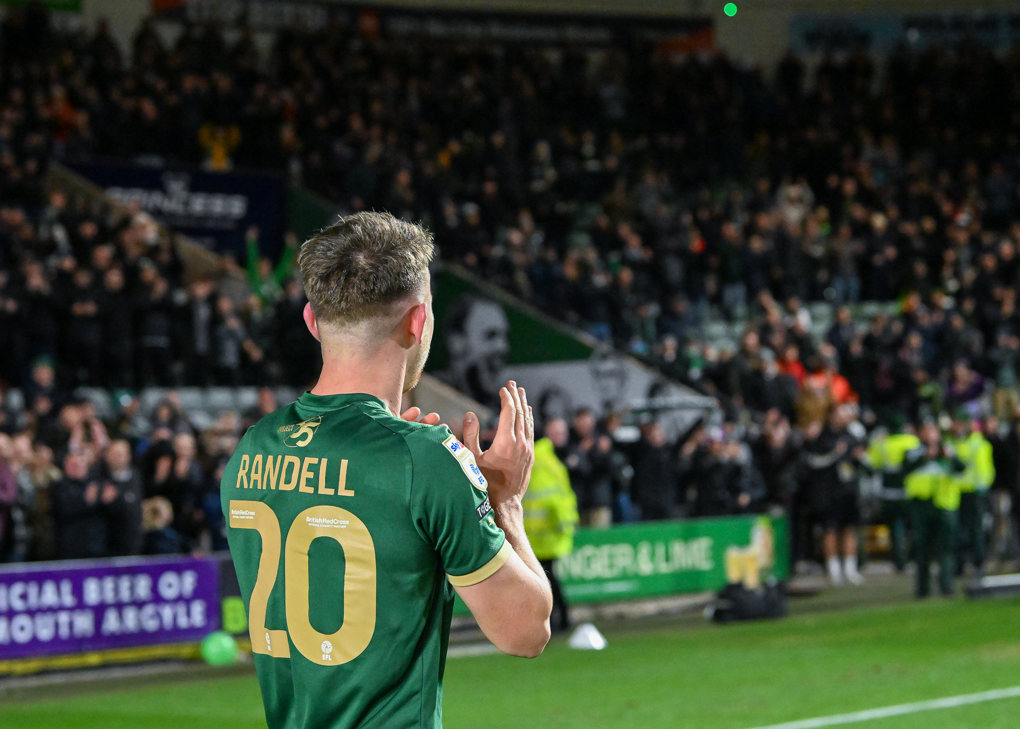 Adam Randell celebrates with the Green Army