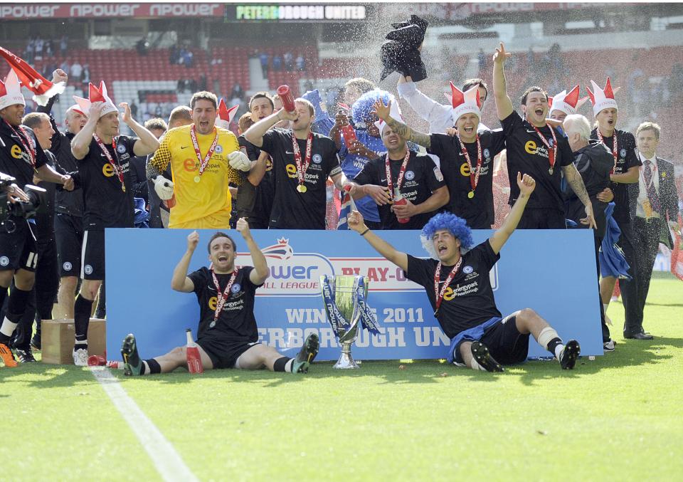Peterborough United celebrate after winning the 2010/11 League One play off final