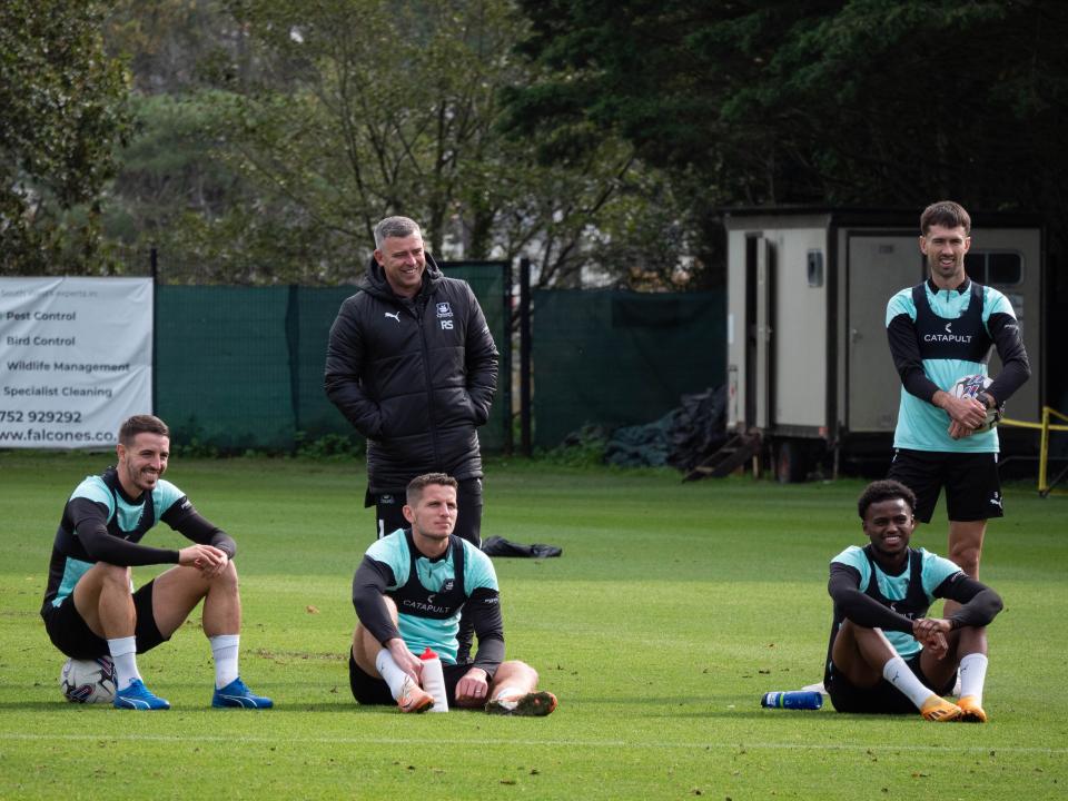 Players watching on.