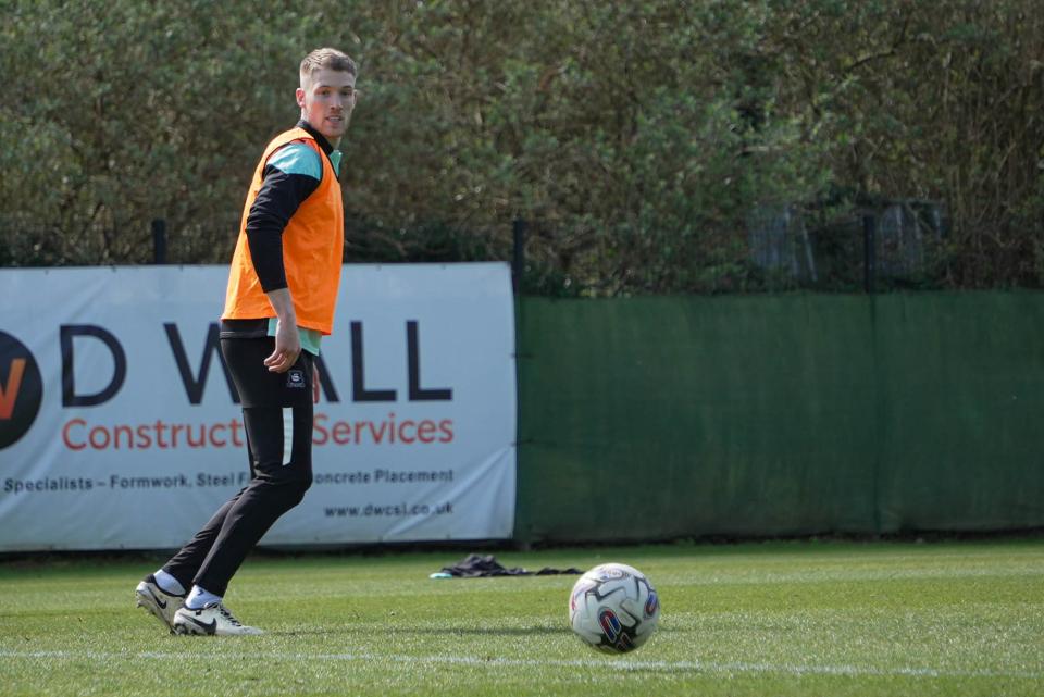 Lewis Gibson prepares to kick off.