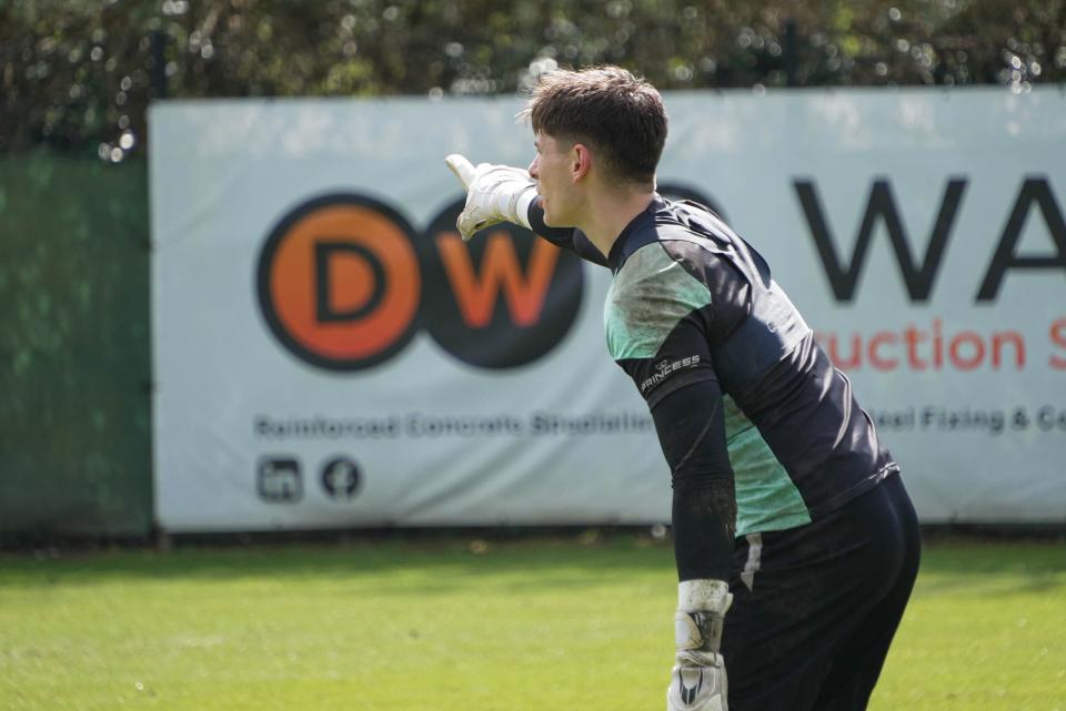 Mike Cooper points from goal.