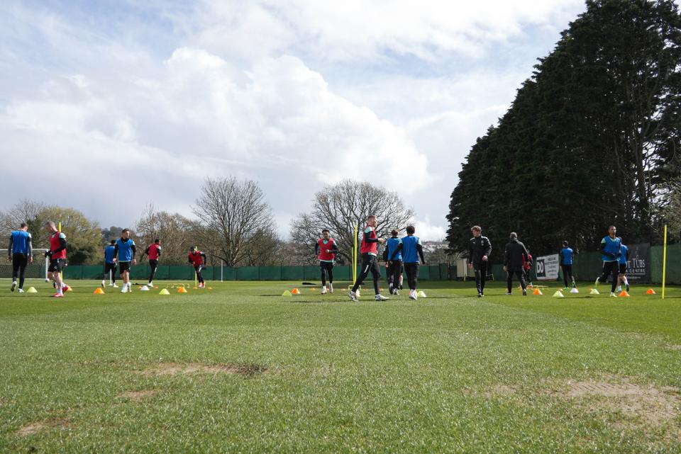 Wide shot of the group warming up.