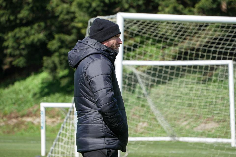 Ian Foster watches on during a training drill.