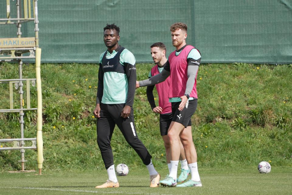 Mustapha Bundu tries to get away from Dan Scarr.