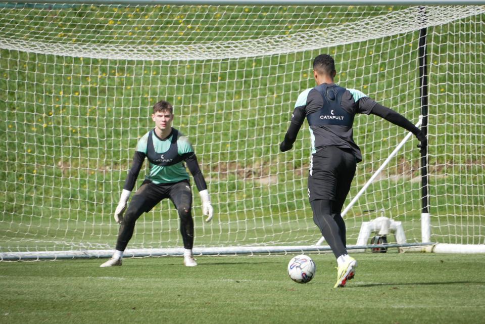 Morgan Whittaker prepares for a shot on goal against Mike Cooper.