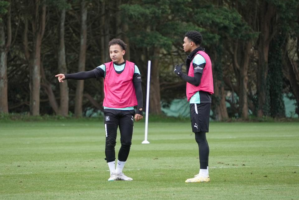 Matty Sorinola and Lino Sousa wait for the training drill to begin.
