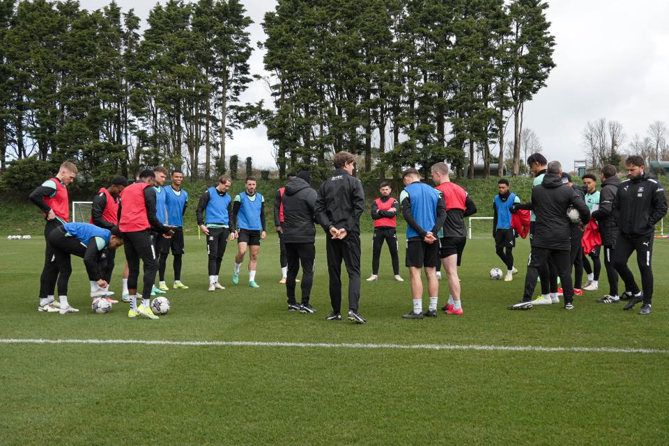 The group listen into a team talk.