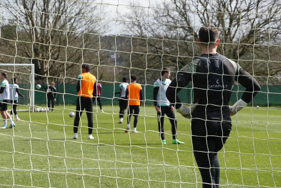 Mike Cooper watches on from goal.