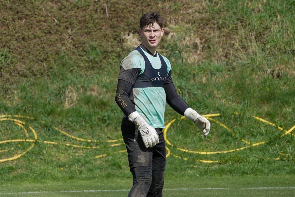 Mike Cooper looks for the ball.