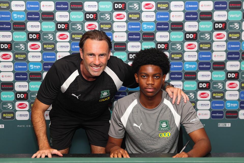 Corey Browne and Under-18s Head Coach Jamie Lowry smile for a photo.