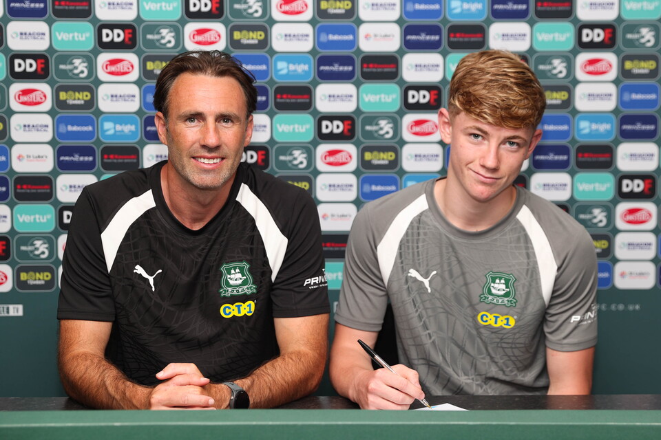 Harry Locke and Under-18s Head Coach Jamie Lowry smile for a photo.