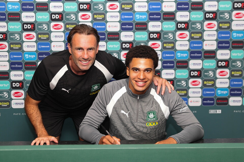 Jovan Wamani and Under-18s Head Coach Jamie Lowry smile for a photo.