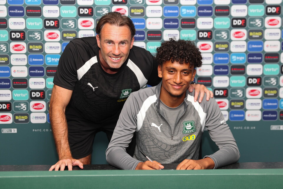 Emran Wischhoff and Under-18s Head Coach Jamie Lowry smile for a photo.