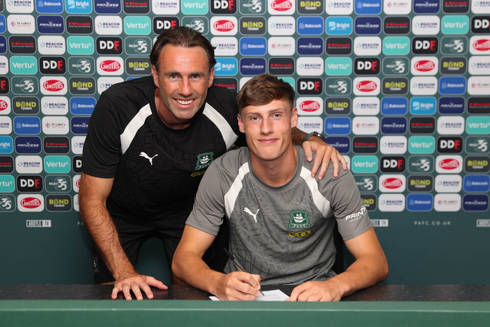 James Sharpe and Under-18s Head Coach Jamie Lowry smile for a photo.