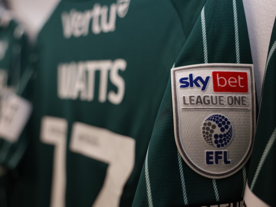Green football shirt with "Watts" and number 17, featuring Sky Bet League One and EFL logos.