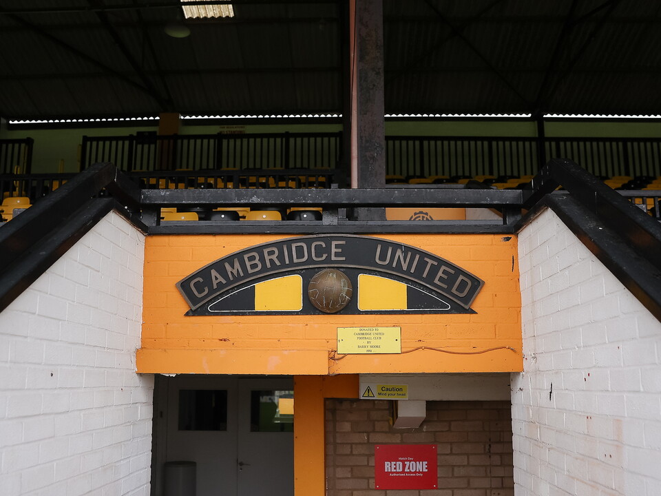Cambridge United entrance with yellow and black signage