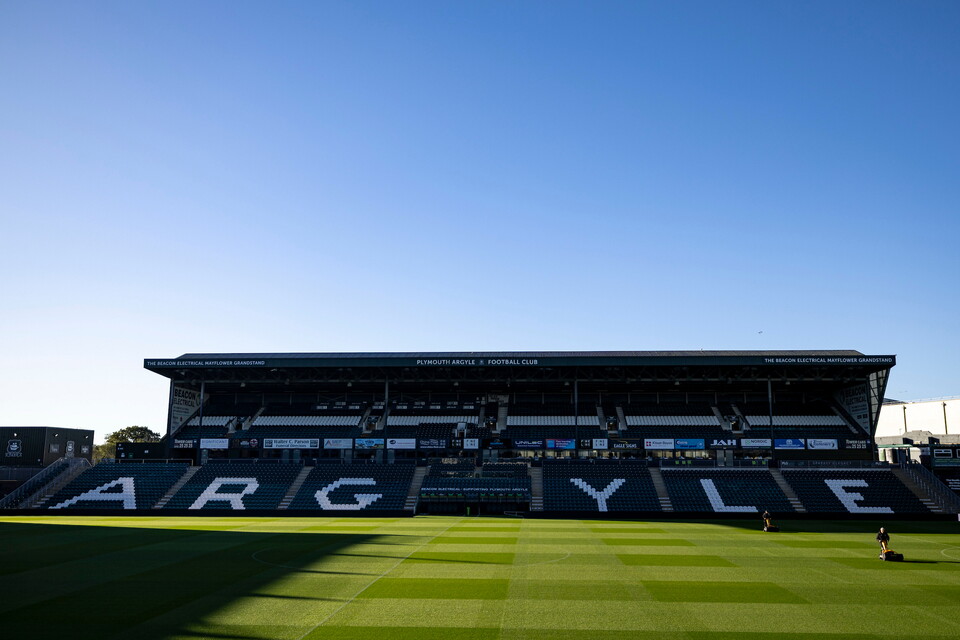 Argyle written on a stadium's stands, overlooking an empty football pitch.