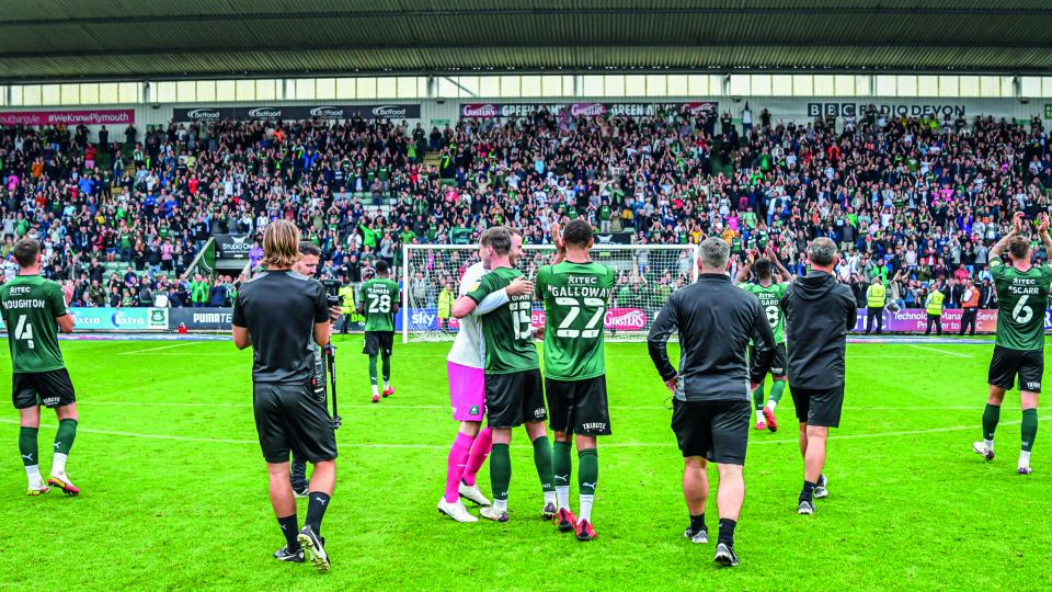Players celebrate with the fans at the Devonport End