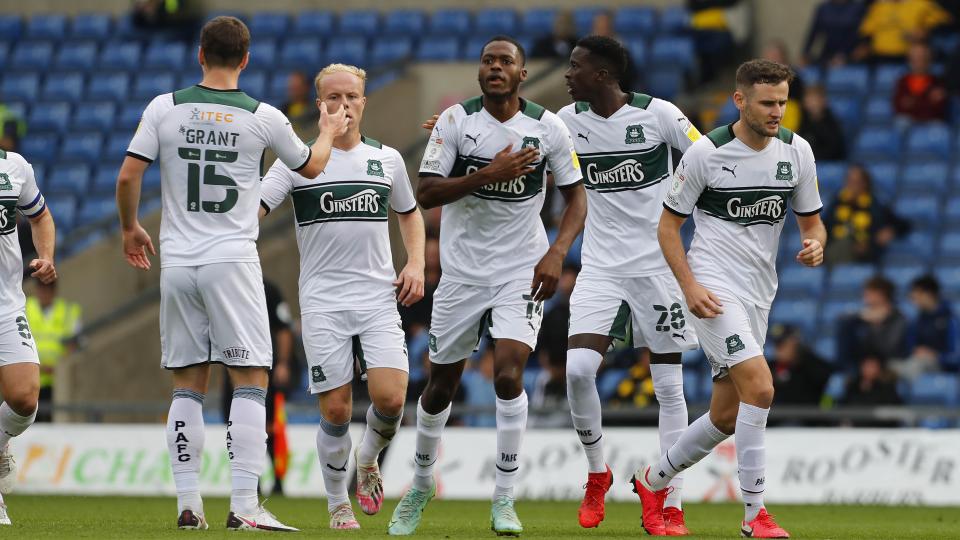 Players celebrate Jordon Garrick's equaliser at Oxford