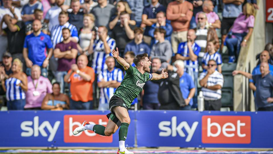 Joe Edwards celebrates scoring the opener