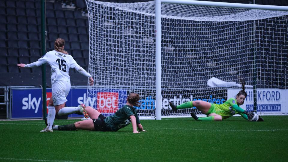 Poppy Soper makes a save against MK Dons Women