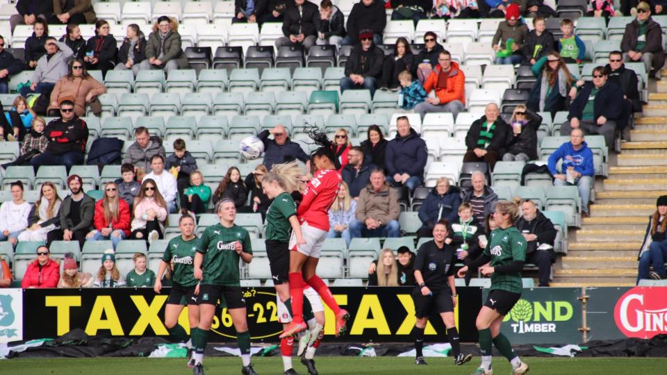 Zoe Cunningham challenges for a header at Home Park