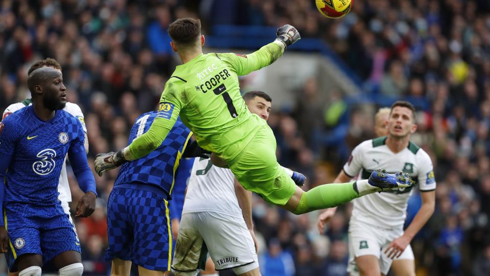 Mike Cooper punches the ball clear at Stamford Bridge