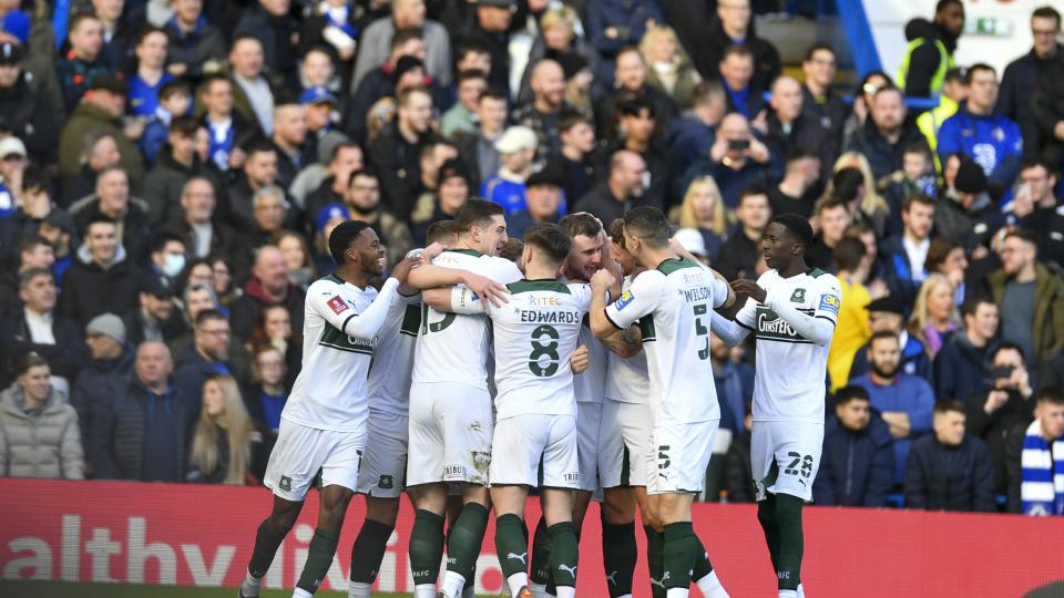 Argyle players celebrate the opener at Stamford Bridge