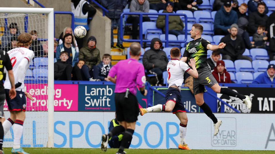 Macaulay Gillesphey heads the winner at Bolton
