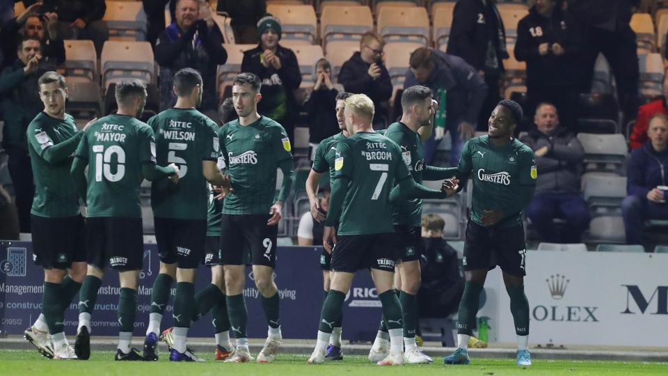 Niall Ennis swamped by his Argyle team-mates