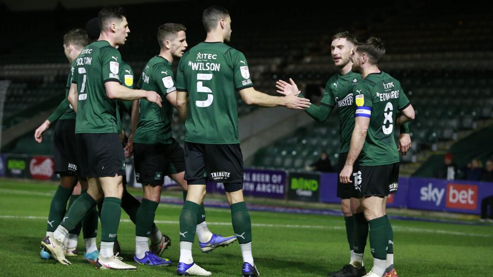 Players celebrate Mayor's goal