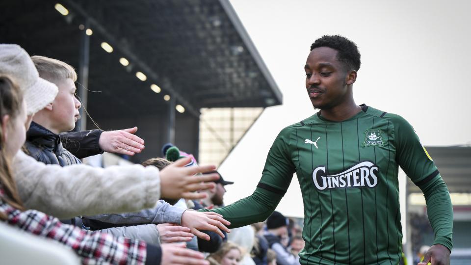 Niall Ennis celebrates with young fans