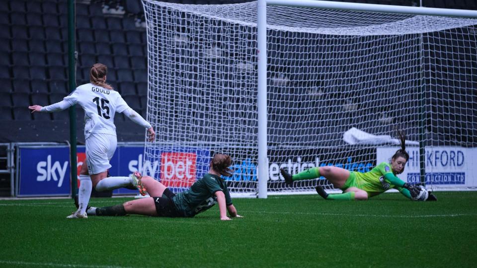 Poppy Soper makes a save against MK Dons Women