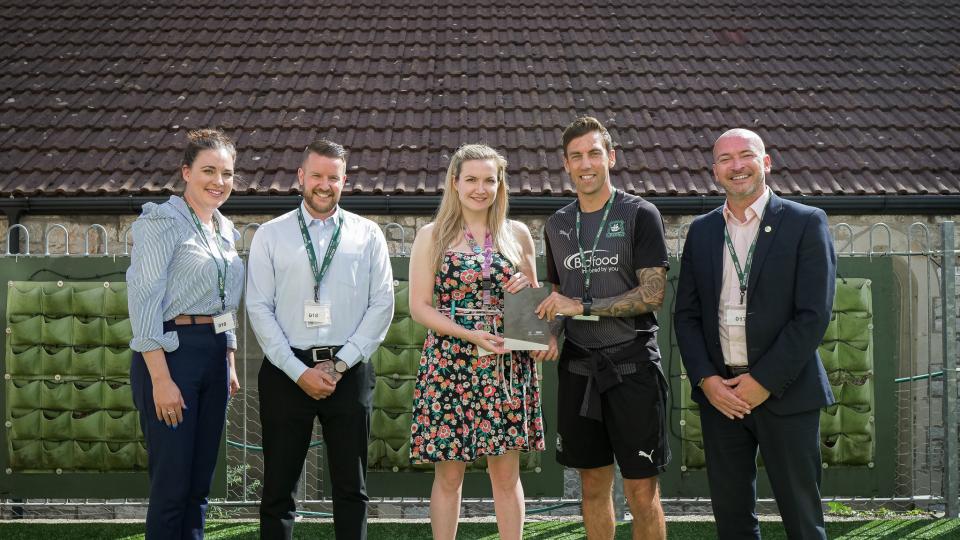 Gary Sawyer with staff from Partners&