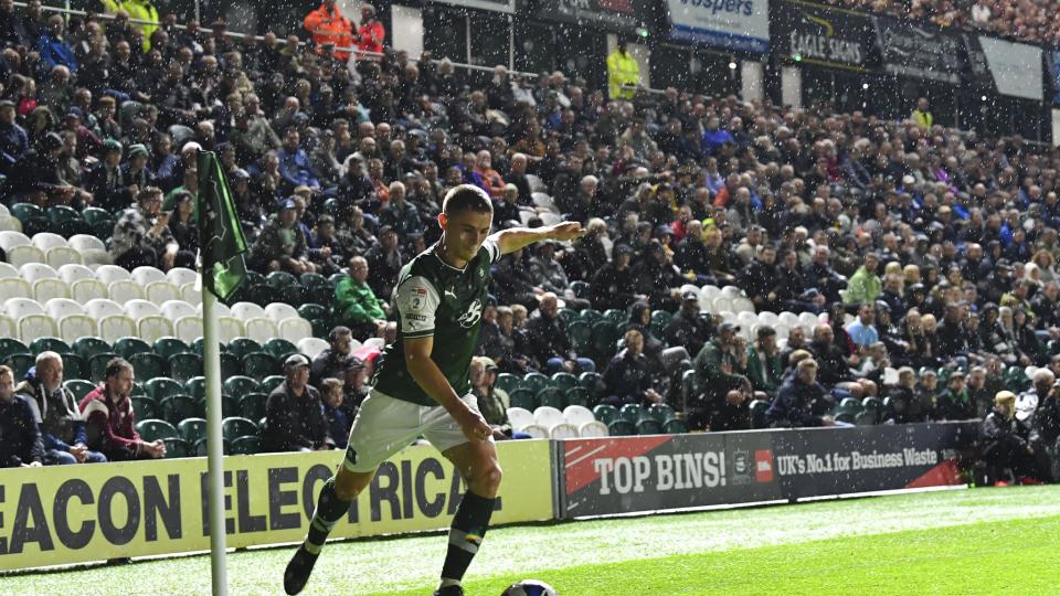 Adam Randell taking a corner against Oxford